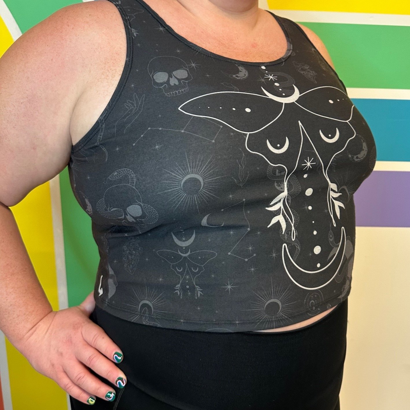 Side view of Occult Crop Top by Left Turn Clothing. Featuring a moth, planets, snakes, and more.
